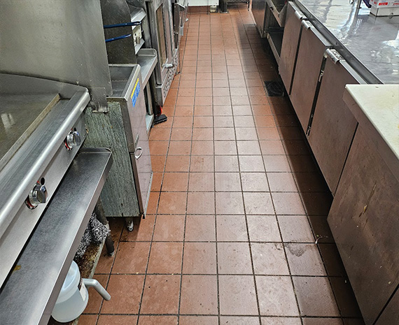 Kitchen grease / degreaser residue on commercial kitchen floor