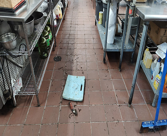 Grease hand gouged out of grouted tile commercial kitchen floor