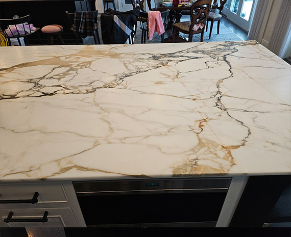 Dull and etched marble island stone counter