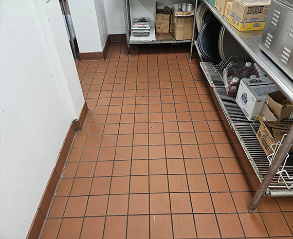 Grouted kitchen floor without the grease buildup