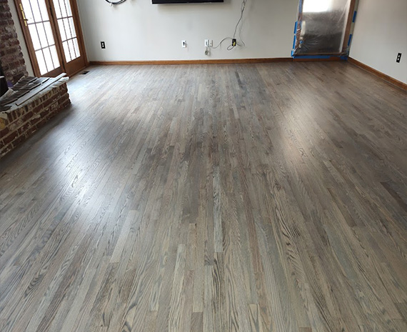 Family room wood floor refinished classic gray stain