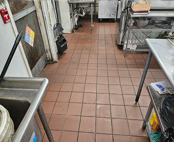 Grease covered commercial kitchen floor