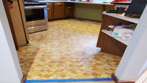 Vintage Kitchen (prob circa Bill Matthews) has 1970's tile which team Ergonomic-Sparkle delightedly updated with Luxury Vinyl Plank