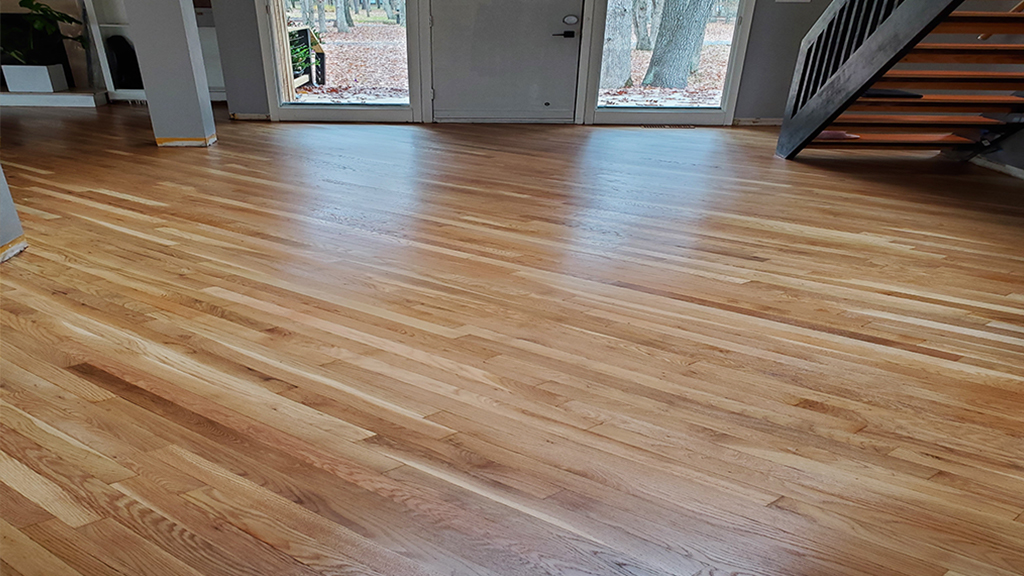 The refinished hardwood in the foyer looks stunning