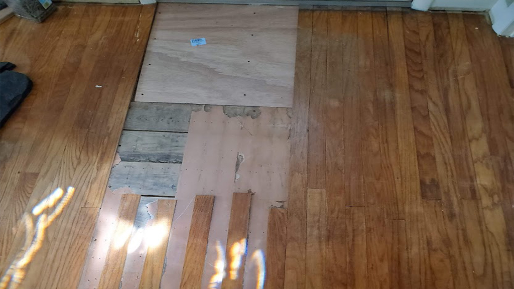 Here the termite damage was cut out, the subfloor was replaced and the boards will soon be replaced
