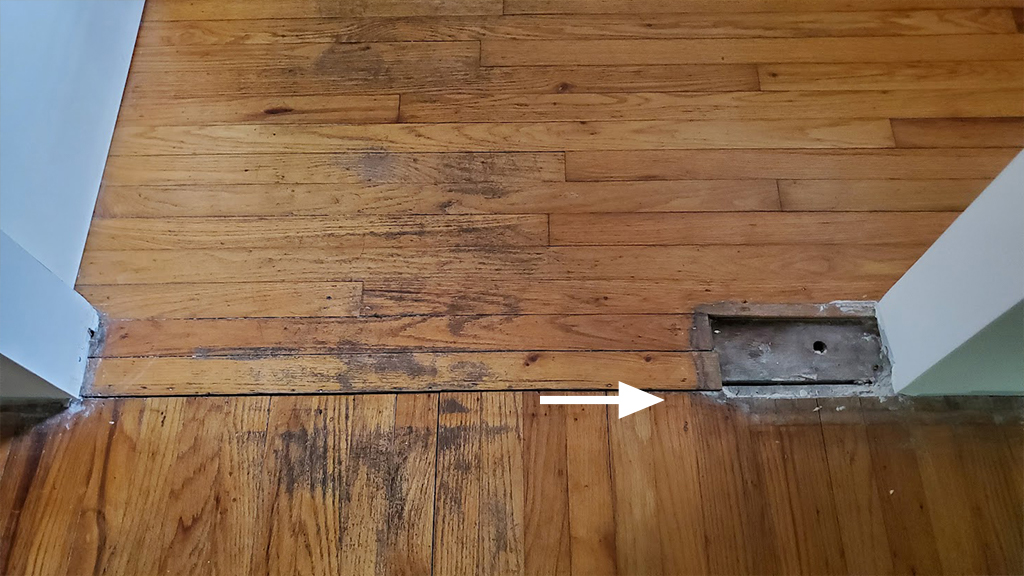 hardwood.Wall.void.before.repairjpg