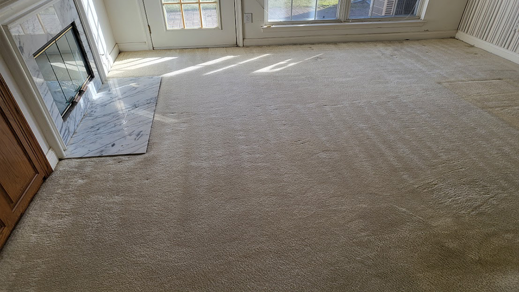 Severe soiling removed, off white carpet looks much cleaner