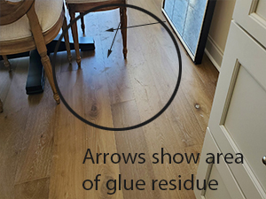 Glue residue pollutes the engineered hardwood floor installation