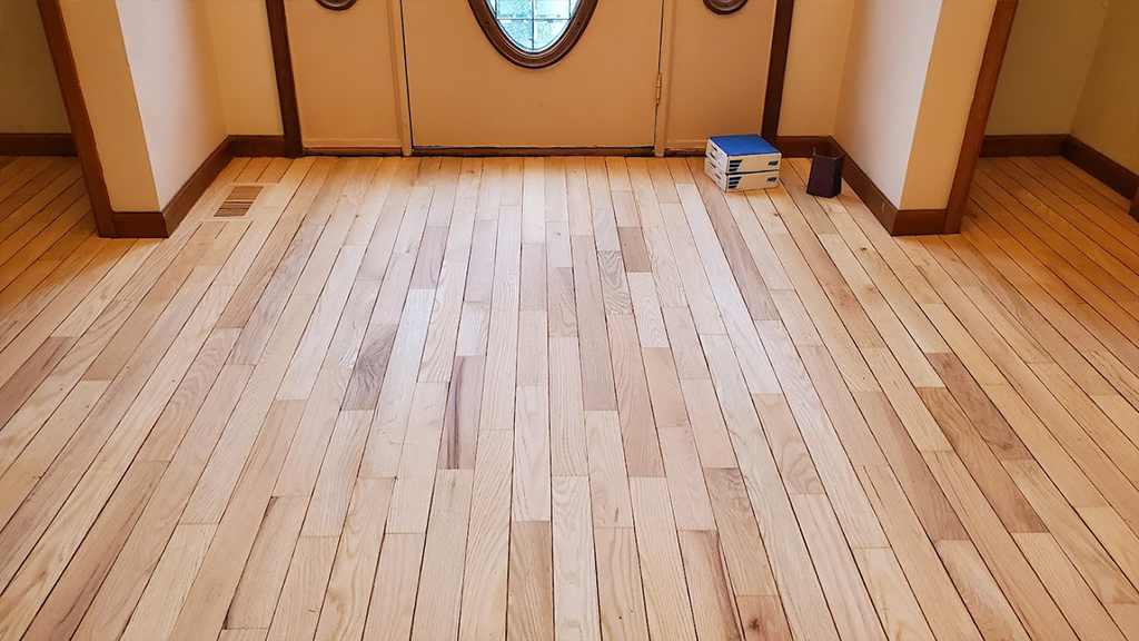 Foyer sanded, removed water damage and termite damage