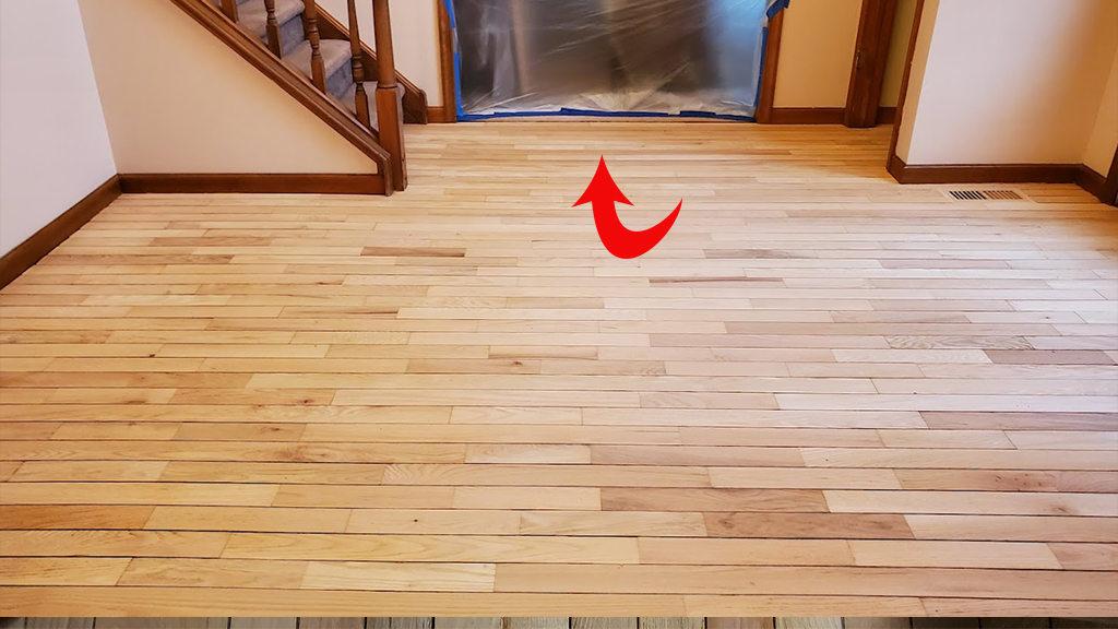 protective plastic isolates wood floor work area