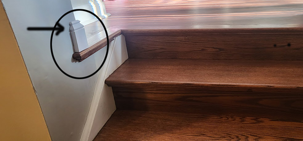 Hardwood floor stair trim detail