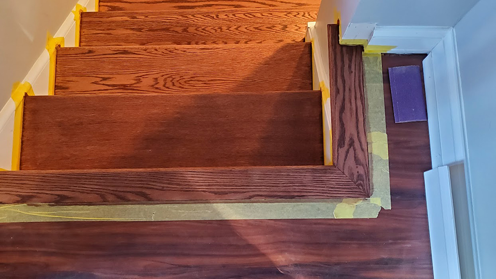 red oak stair nosing installed at top of bottom stairs
