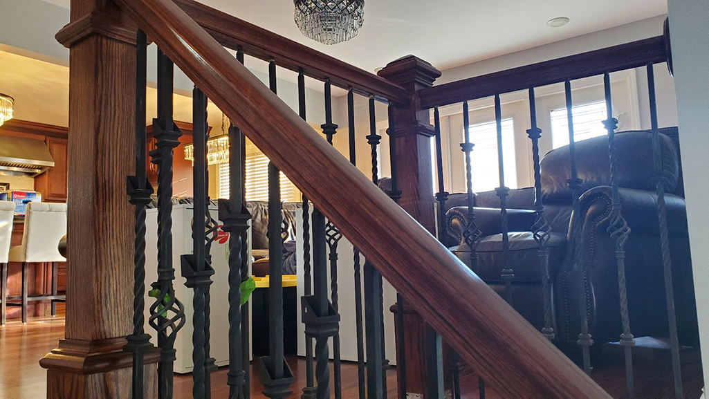 Red oak railing fixed- uniformly sanded so the stain is even and the railing is smooth