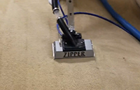 Zipper wand cleaning dirty carpet