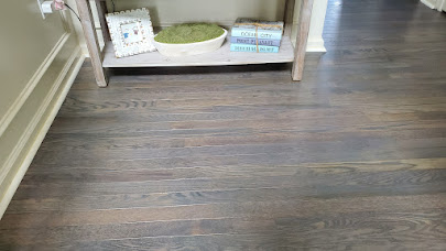 lighter walls enhance the gray tone beachy hardwood stained floors