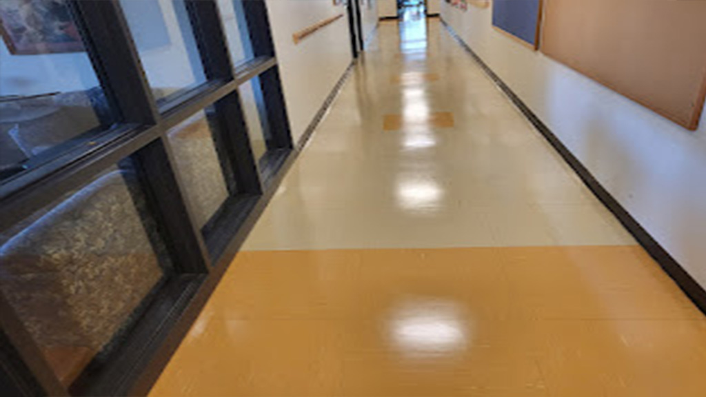 Dull VCT floors are stripped & rewaxed