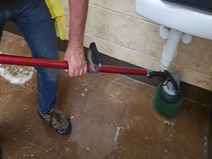 power scrubbing tile floor