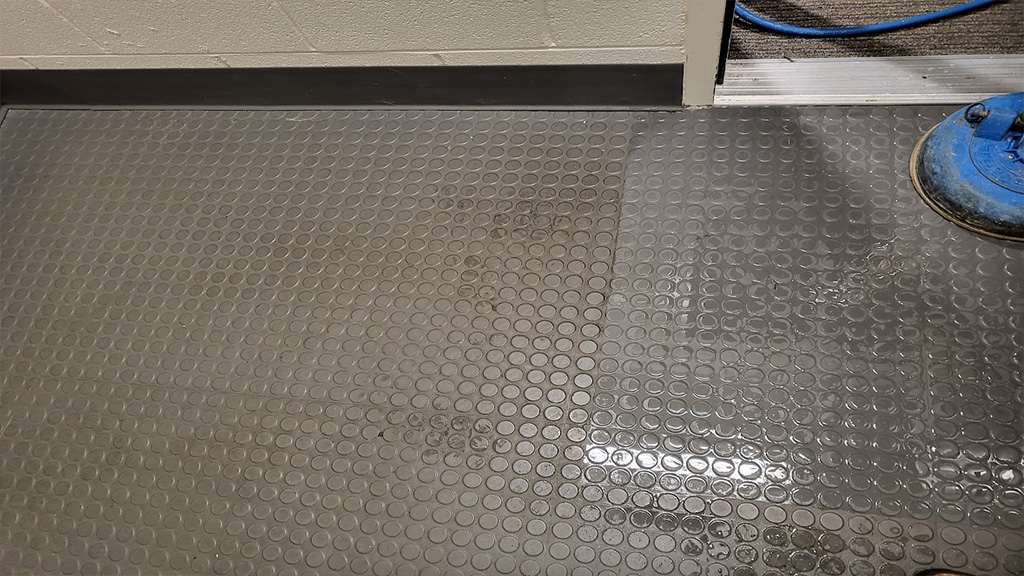 starting to steam clean a rubber studded floor