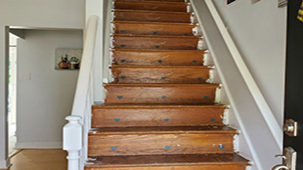 cheap old pine stairs with tacky stencils