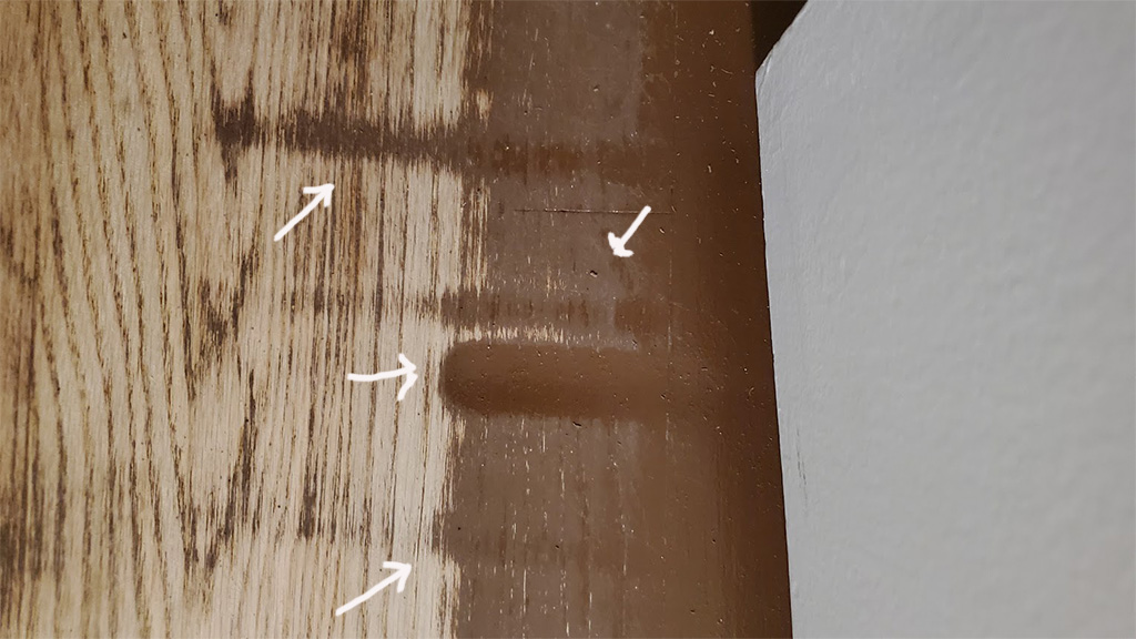 bad hardwood floor sanding drum marks along wall