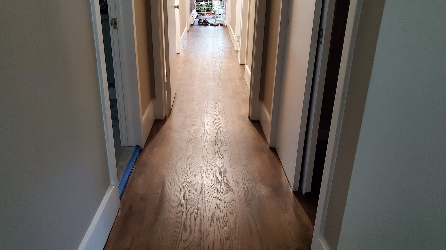 Opposing view of resanded & stained hallway in Yardley