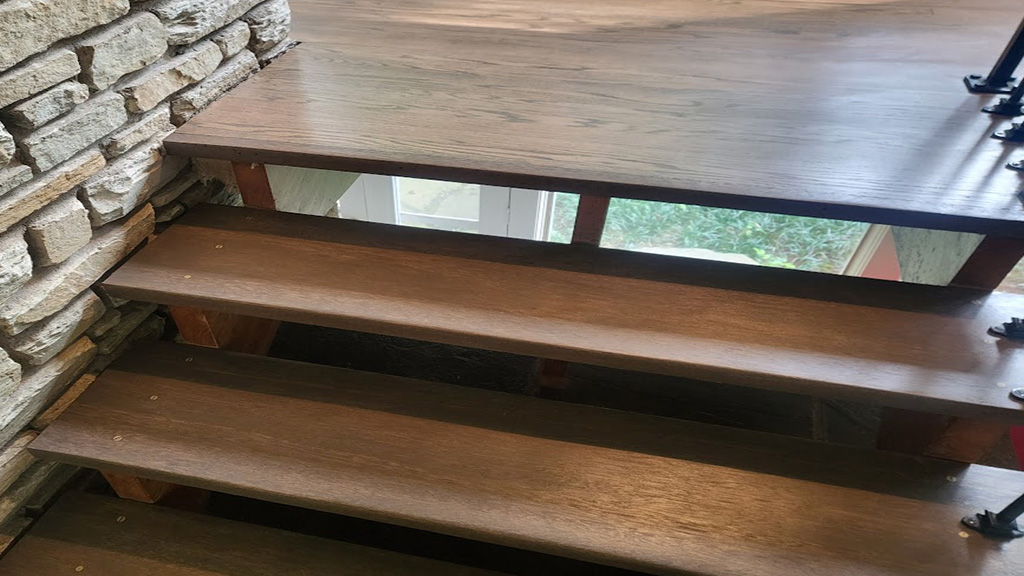 resanded, repaired, refinished mahogany floating stairs in Yardley