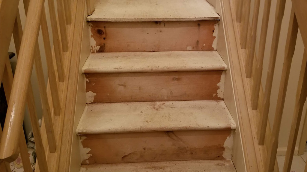 Mt Laurel subfloor stairs and risers before upgrading with real wood