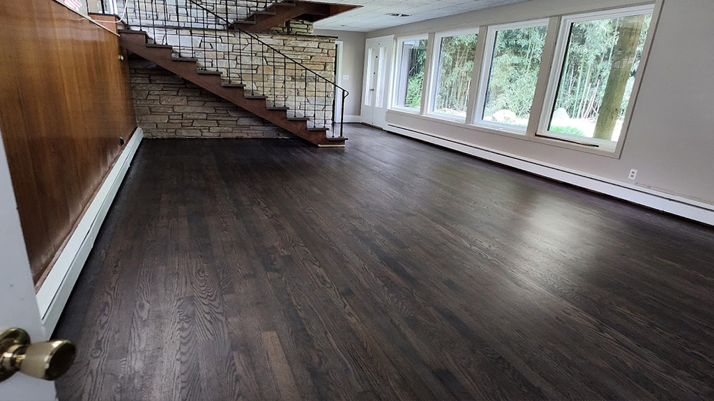 Morrisville pet stains fixed with re0sanding & refinishing with medium gray stain