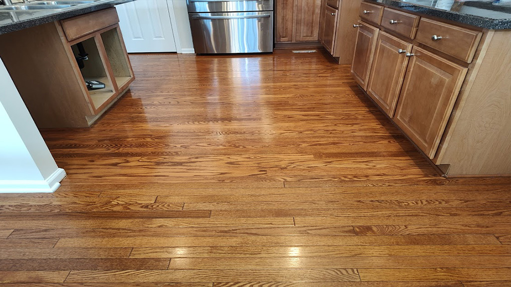 Red oak stained kitchen wood matches dining area