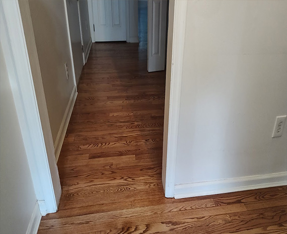 Medford Lakes wood refinished flush transition main hall done 570x465jpg