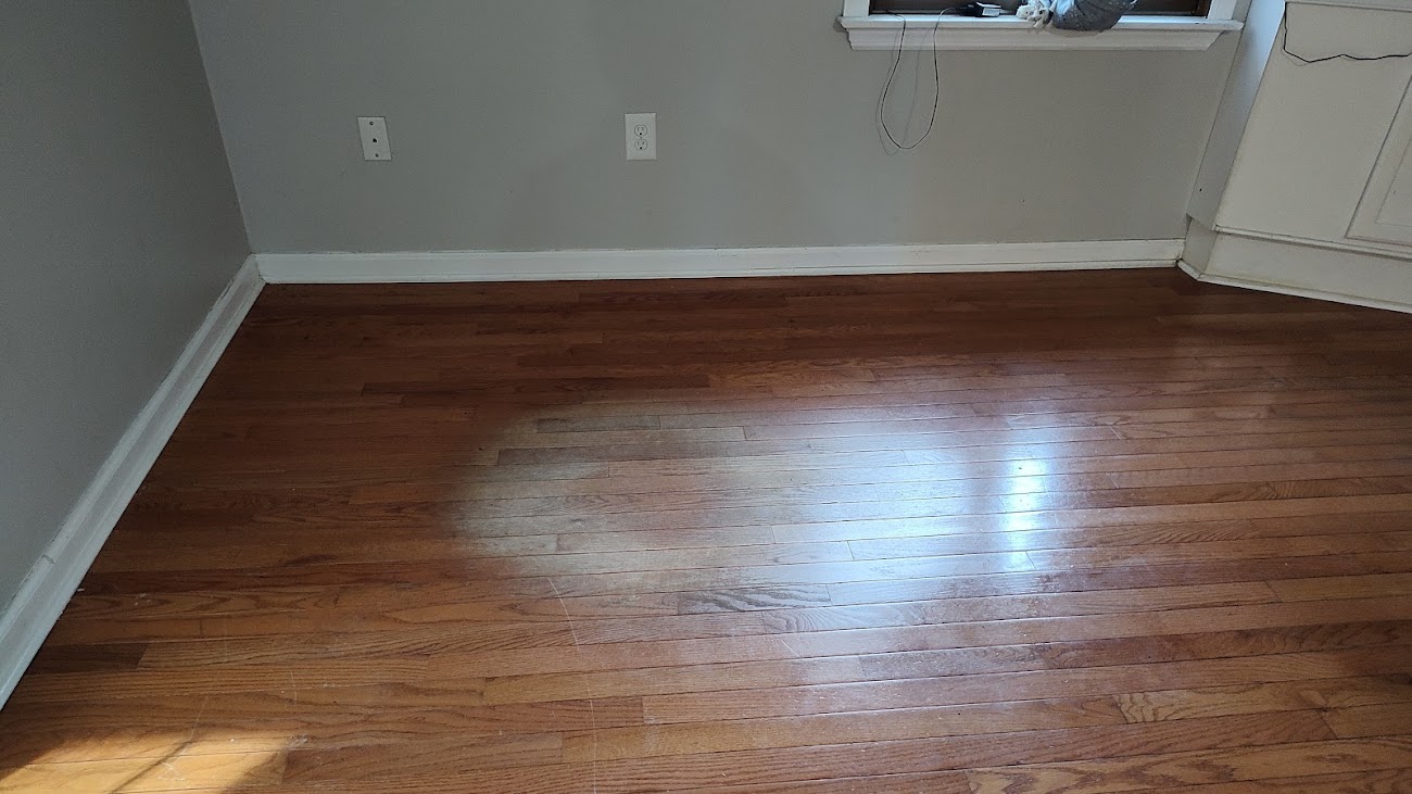 Something round sanded a mark on the wood floor.