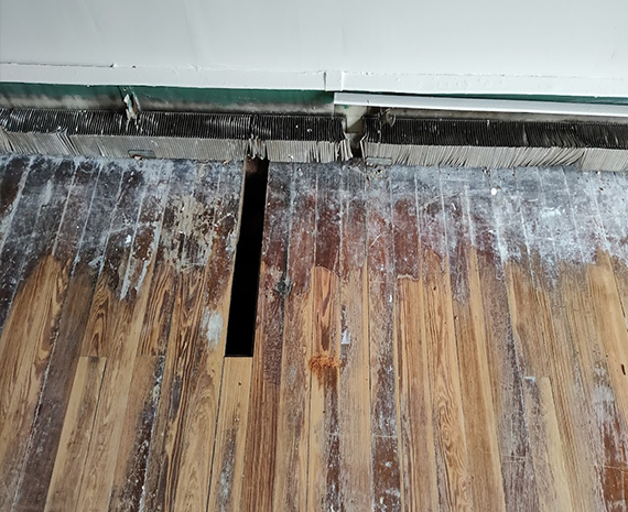 Board with pipe hole in it removed & replaced 570 x 465