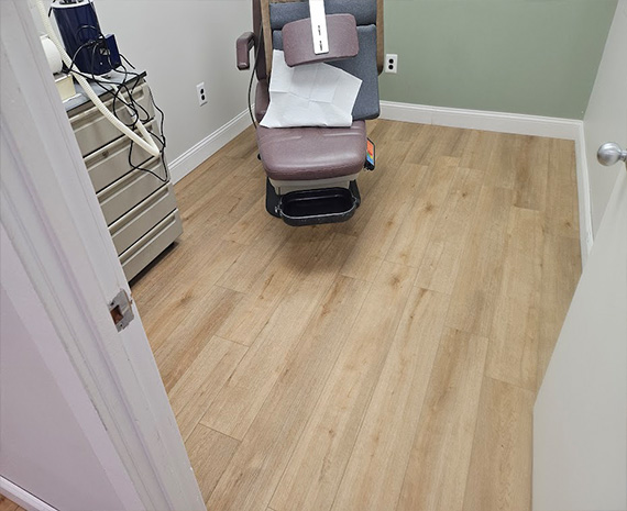 Steam clean sanitize LVP podiatry exam room