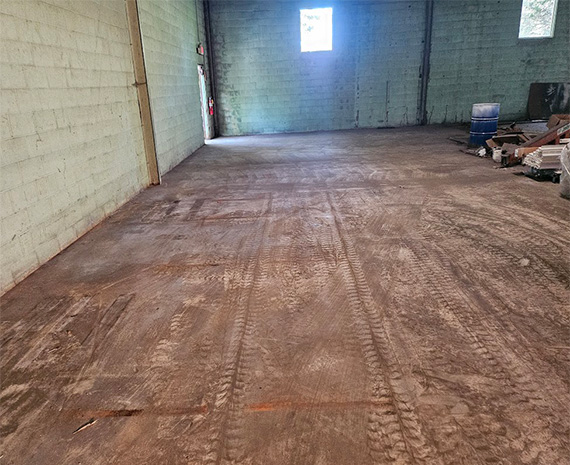 Close up flooded corner of industrial warehouse