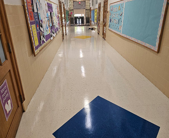 Merchantville Catholic VCT floor stripped & waxed