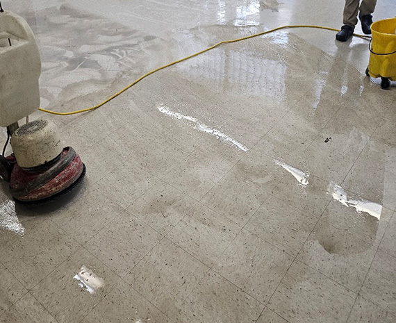 Scrubbing removes wax & dirt from VCT school classroom floor