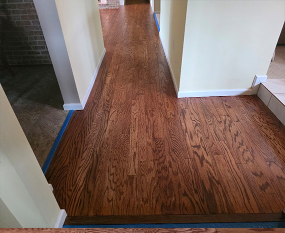 Engineered hardwood over radiant heat refinished with custom stain and satin finish.