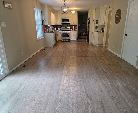 Refinished hardwood floors with custom flush transition in Tabernacle, NJ