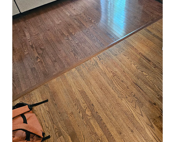 Old raised hardwood floor transition before refinishing in Tabernacle, NJ